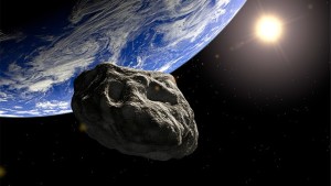 Un asteroide pasando cerca de la Tierra. Crédito: HelloScience.us