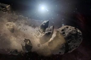 Concepto artístico de un asteroide despedazándose en el espacio. Crédito: NASA/JPL-Caltech