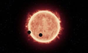 Concepto artístico de planetas con un tamaño similar a la Tierra alrededor de una enana roja. Crédito: NASA, ESA, y G.Bacon (STScI)
