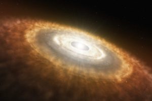 Concepto artístico del inicio del Sistema Solar, en el que la colisión de las partículas en el disco de acreción desembocó en la formación de planetesimales y, eventualmente, planetas.  Crédito: NASA/JPL-Caltech