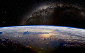 Representación artística de la Tierra y la Vía Láctea vistas desde el espacio.